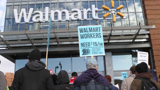 Protesters gather in front of a Walmart store in Washington, D.C., on November 28, 2014, to demand better wages.