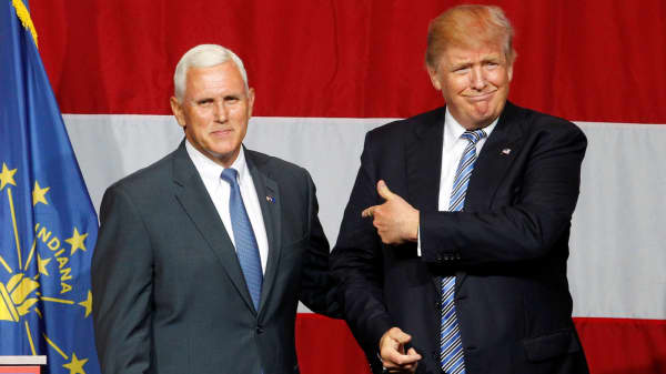 Republican presidential candidate Donald Trump (R) and Indiana Governor Mike Pence (L) before addressing the crowd during a campaign stop at the Grand Park Events Center in Westfield, Indiana, July 12, 2016.