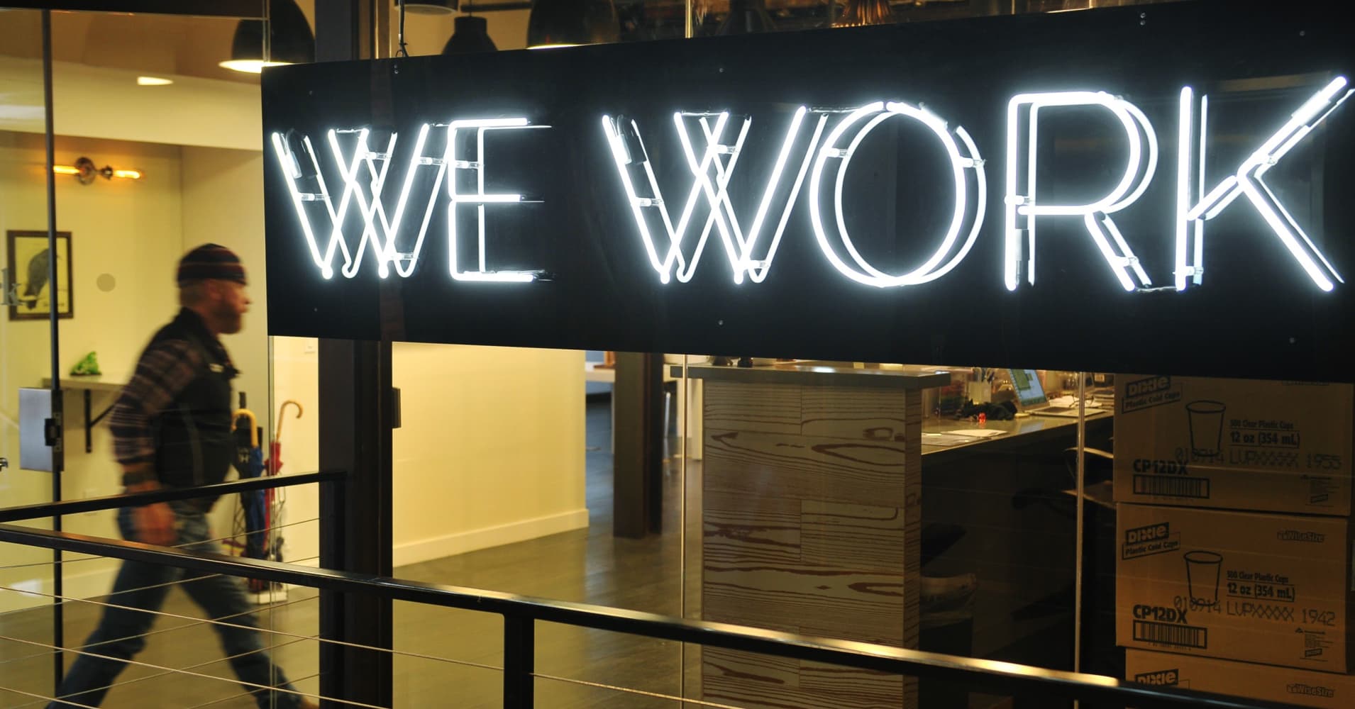SoftBank invests billions less in WeWork than it originally planned, and now WeWork is rebranding