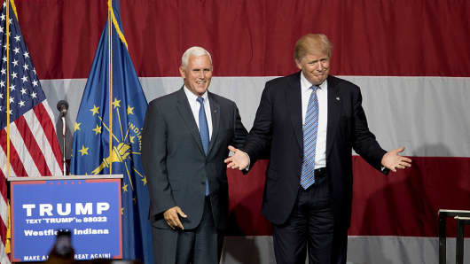 Republican presidential candidate Donald Trump greets Indiana Gov. Mike Pence