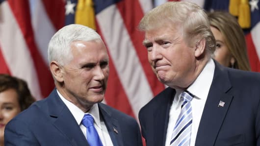 Presidential candidate Donald Trump (R) shakes hands with Indiana Governor Mike Pence after Trump introduced Pence as his vice presidential running mate in New York City, July 16, 2016.
