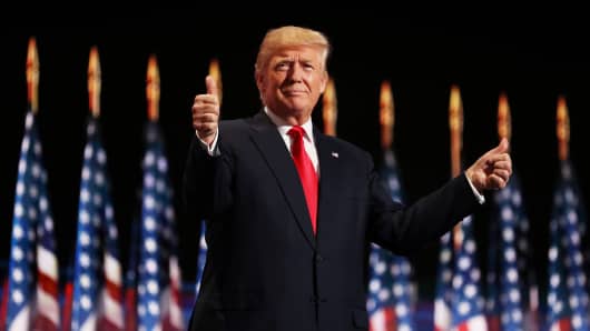 Republican presidential candidate Donald Trump gives two thumbs up to the crowd during the evening session on the fourth day of the Republican National Convention on July 21, 2016 at the Quicken Loans Arena in Cleveland, Ohio.