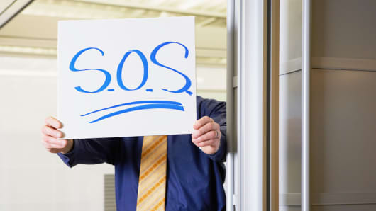 Worker with SOS sign