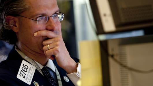 Donald Civitanova works at a post on the floor of the New York Stock Exchange in New York, U.S., on Thursday, May 6, 2010. The Dow Jones Industrial Average had its biggest intraday loss since the market crash of 1987.