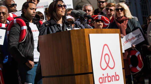 Linda Merlo, an airbnb host from the Bronx, speaks at a rally on the steps of New York City Hall showing support for the company on October 30, 2015 in New York City. The New York City council is currently debating how to regulate the controversial company.