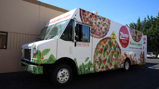 Zume developed its own special delivery truck with 56 ovens so the pizza can cook while en route to customers.