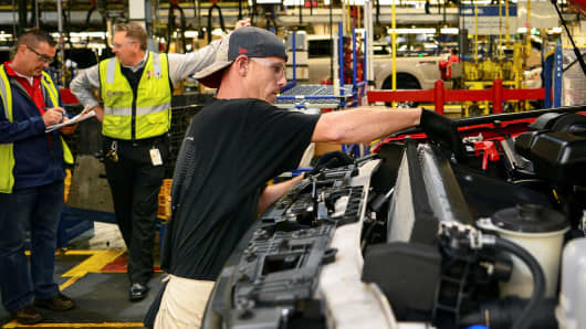 A worker assembles a Ford truck at the new Louisville Ford truck plant in Louisville, Kentucky.