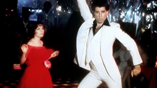 Actor John Travolta dances with Karen Lynn Gorney in scene from movie 'Saturday Night Fever.'