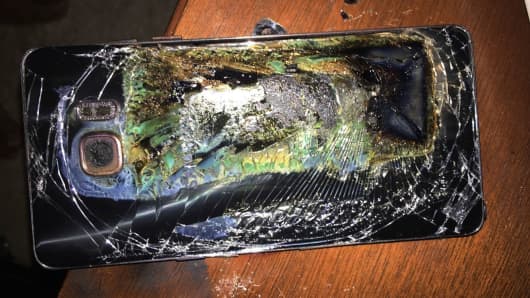 This Oct. 9, 2016 photo shows a damaged Samsung Galaxy Note 7 on a table in Richmond, Va., after it caught fire earlier in the day.