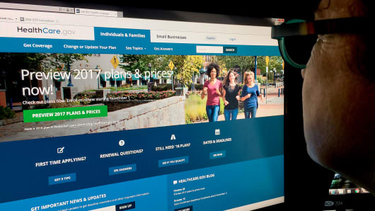 A woman looking at the Healthcare.gov internet site.