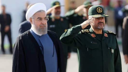 Iranian President Hassan Rouhani (left) and IRGC Major General Mohammad Ali Jafari