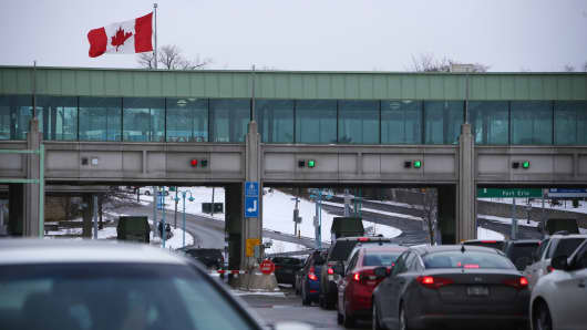 Vehicles make their way through the Canadian border crossing in Niagara Falls, Ontario, Canada.