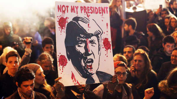 Protestors gather outside Trump Tower in New York during a protest against President-elect Donald Trump on November 9, 2016.