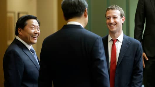In this Wednesday, Sept. 23, 2015, file photo, Chinese President Xi Jinping, center, talks with Facebook Chief Executive Mark Zuckerberg, right, as Lu Wei, left, China's Internet czar, looks on during a gathering of CEOs and other executives at Microsoft's main campus in Redmond, Wash.