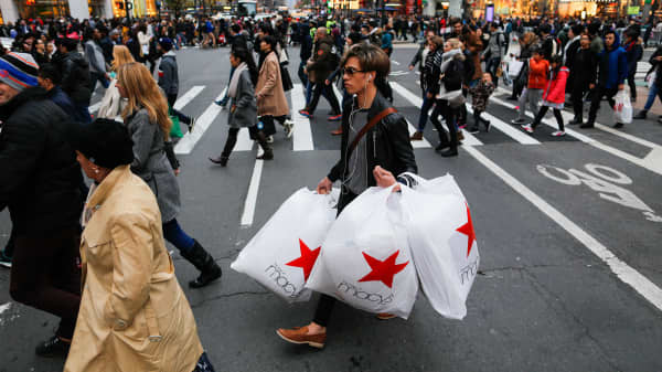 People carry retail shopping bags during Black Friday events on November 25, 2016 in New York City.