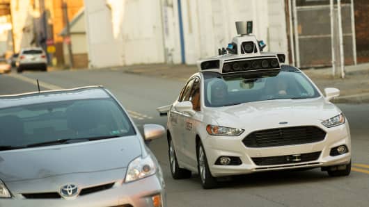 An Uber driverless Ford Fusion drives down Smallman Street on September, 22, 2016 in Pittsburgh, Pennsylvania. 