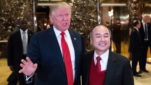 Donald Trump, then President-Elect, appears with SoftBank's Masayoshi Son to speak to media in the lobby at Trump Tower in New York, Tuesday, Dec. 6, 2016.