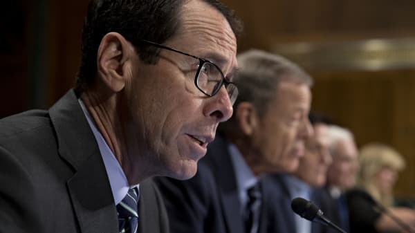 Randall Stephenson, chairman and chief executive officer of AT&T, speaks during a Senate hearing, Dec. 7, 2016.