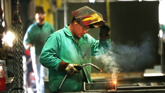 An employee welds pipe at Pioneer Pipe in Marietta, Ohio.