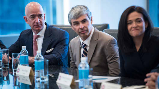 From left Amazon founder Jeff Bezos, Alphabet CEO Larry Page, and Facebook COO Sheryl Sandberg listen during a meeting with technology industry leaders at Trump Tower in New York, NY on Wednesday, Dec. 14, 2016.