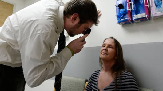 A neurologist checks a patient during an exam at the St. Vincent Hospital in Leadville, Colorado.
