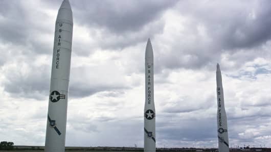 'Peacekeeper' missile, left, and two versions of the Minuteman missile sit at the entrance of Warren Air Force base July 11, 2001 near Cheyenne, WY.