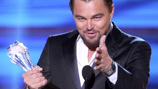 Actor Leonardo DiCaprio accepts the award for Best Actor in a Comedy for 'The Wolf of Wall Street' onstage during the 19th Annual Critics' Choice Movie Awards at Barker Hangar on January 16, 2014 in Santa Monica, California.