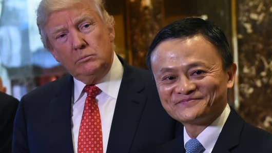 Jack Ma (R), founder and executive chairman of Alibaba Group, and President-elect Donald Trump pose for the media after their meeting at Trump Tower January 9, 2017.
