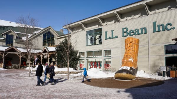 People walk through a plaza at an entrance to the L.L. Bean flagship store in Freeport, Maine on Monday, January 9, 2017.