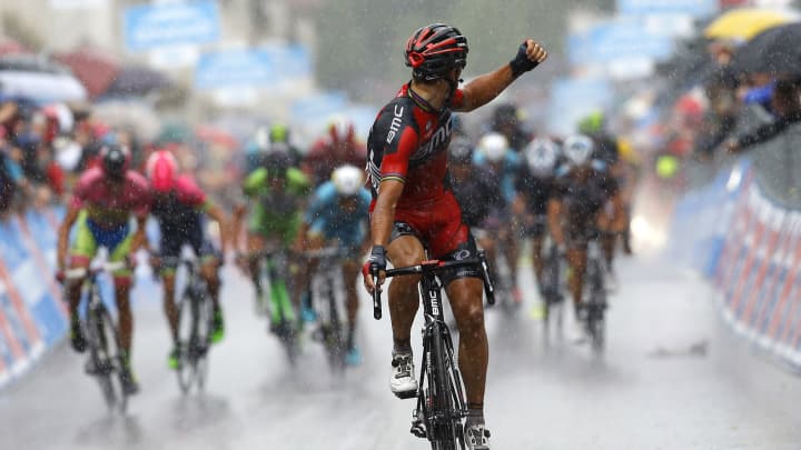 Belgian Philippe Gilbert of the BMC team celebrates as he crosses the finish line under heavy rain to win the 12th stage of the 98th Giro d'Italia, Tour of Italy, cycling race between Imola and Vicenza on May 21, 2015 in Vicenza. 