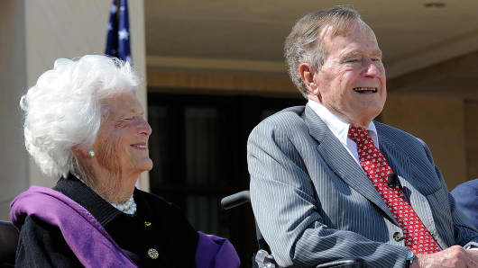 Former President George H.W. Bush sits with his wife, Barbara, during the dedication ceremony of the George W. Bush Presidential Center in Dallas, on April 25, 2013.