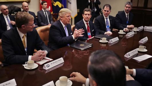 President Donald Trump delivers opening remarks during a meeting with (L-R) Wendell Weeks of Corning, Alex Gorsky of Johnson & Johnson, Michael Dell of Dell Technologies, Mario Longhi of US Steel, and other business leaders and administration staff in the Roosevelt Room at the White House, Jan. 23, 2017 in Washington, DC.