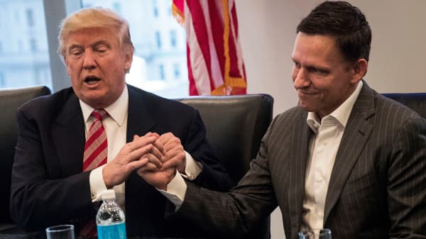 Then-president-elect Donald Trump shakes the hand of Peter Thiel during a meeting with technology executives at Trump Tower, December 14, 2016 in New York City.