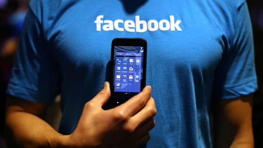  Facebook employee holds an Android phone. 