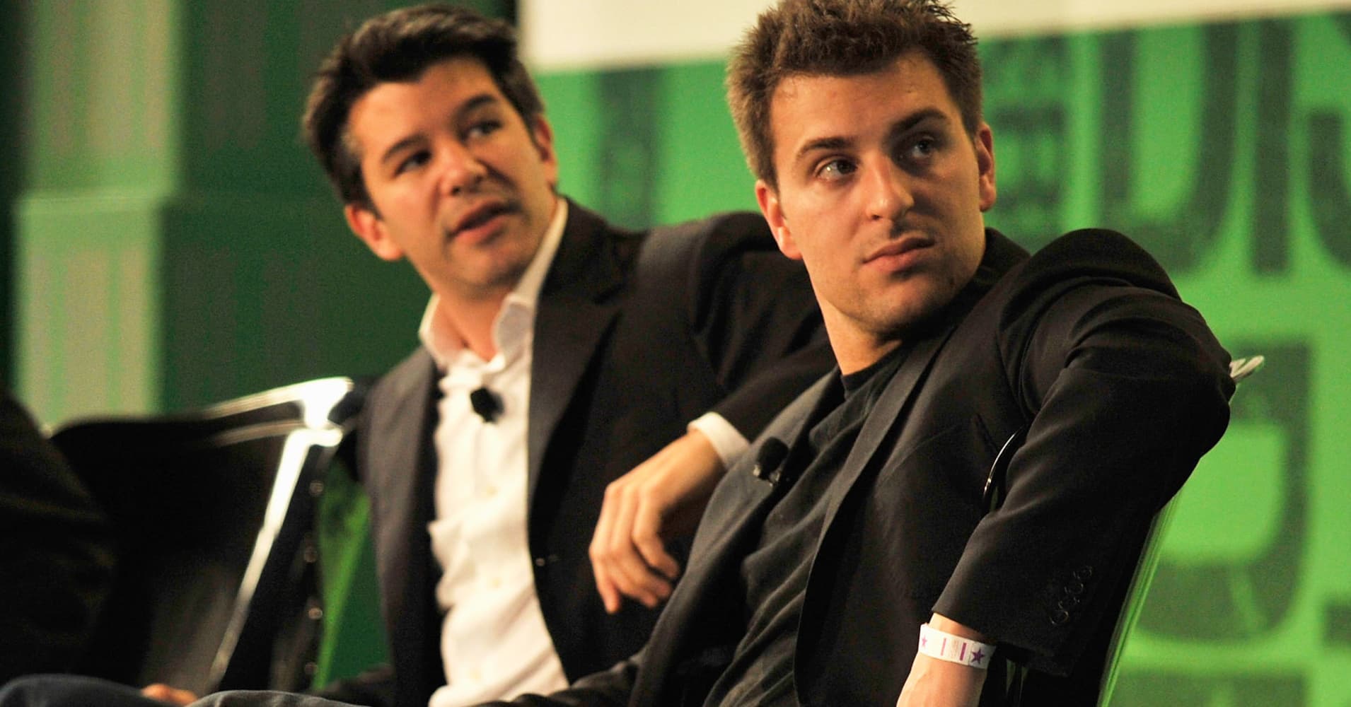 Travis Kalanick, CEO of Uber, left, and Brian Chesky CEO of Airbnb.