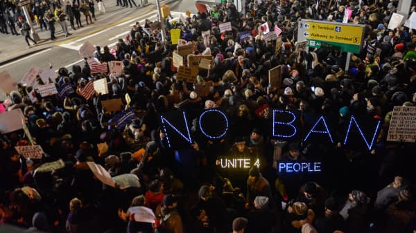 Protesters rally during a demonstration against the travel ban at John F. Kennedy International Airport on January 28, 2017 in New York City.