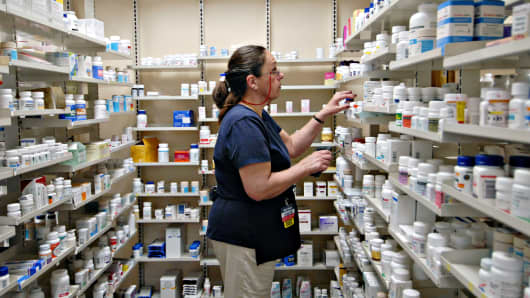 A pharmacy technician fills a prescription inside a Wal-Mart store in Trevose, Pennsylvania.