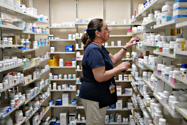 A pharmacy technician fills a prescription inside a Wal-Mart store in Trevose, Pa.
