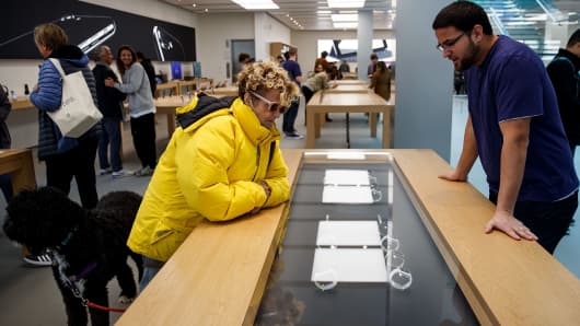 A customer views a display featuring Apple Watch Nike+ at an Apple Store in the SoHo neighborhood of Manhattan.