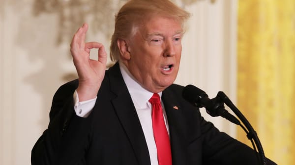 President Donald Trump answers questions during a news conference at the White House.
