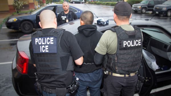 U.S. Immigration and Customs Enforcement (ICE) officers detain a suspect as they conduct a targeted enforcement operation in Los Angeles, California, U.S. on February 7, 2017.