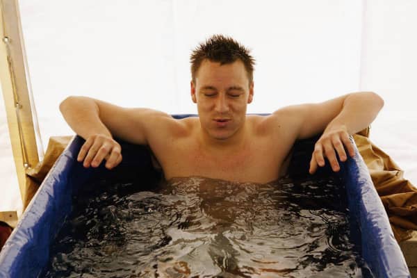 English soccer player John Terry sits in an ice bath to assist recovery from an injury.