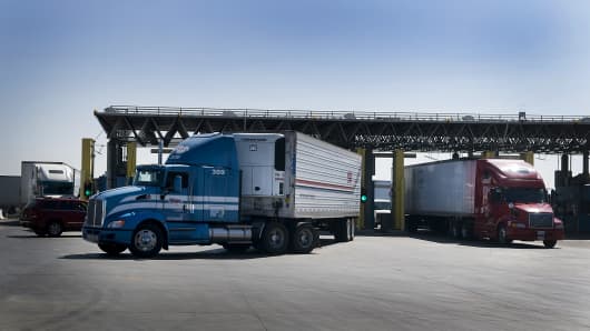 Trucks from Mexico enter a U.S. Customs and Border Protection inspection station at the Otay Mesa Port of Entry in San Diego.