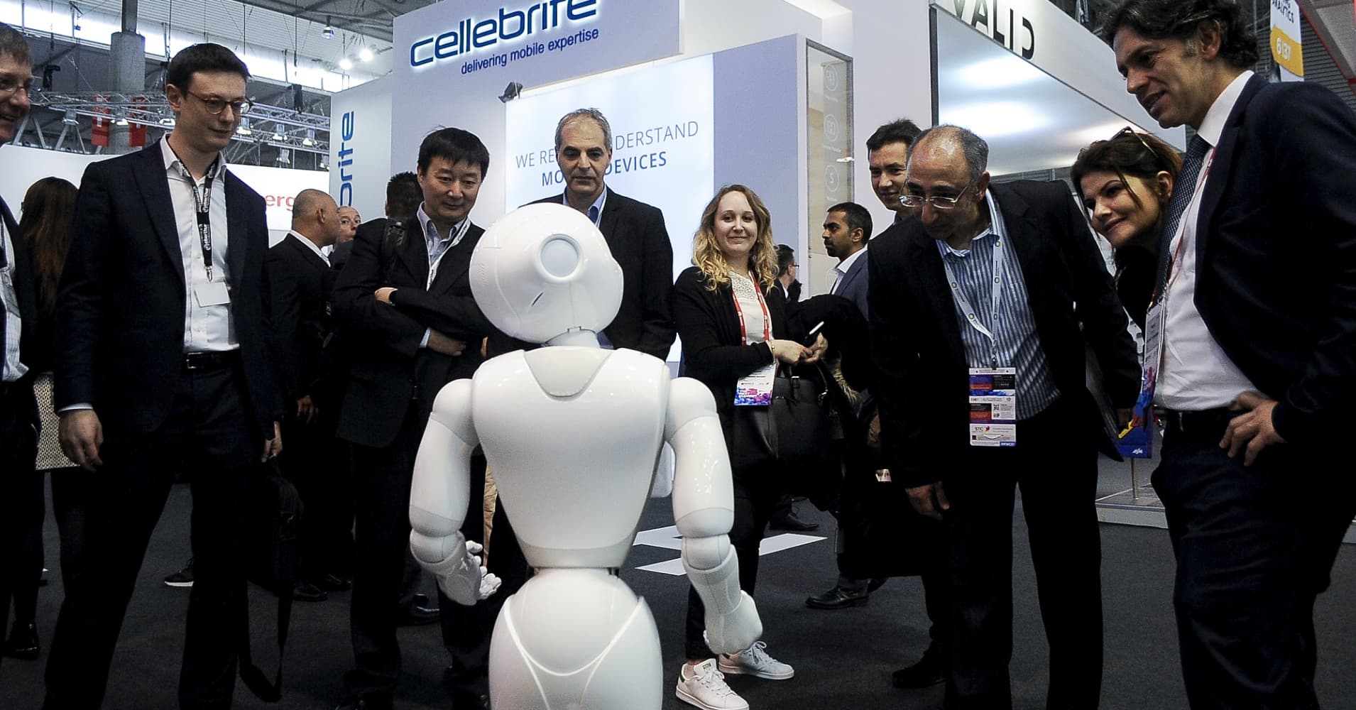Congess attendees speak with a robot during the Mobile World Congress, on February 27, 2017 in Barcelona, Spain.