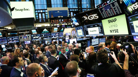 Traders on the floor of the New York Stock Exchange wait for Snap Inc to post their IPO in New York, March 2, 2017.