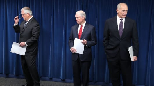 Attorney General Jeff Sessions (R), Secretary of Homeland Security John Kelly (L) and Secretary of State Rex Tillerson (C) take part in a news conference about issues related to a reconstituted travel ban at the U.S. Customs and Borders Protection headquarters, on March 6, 2017 in Washington, DC.