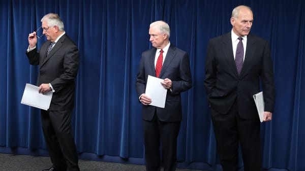 Attorney General Jeff Sessions (R), Secretary of Homeland Security John Kelly (L) and Secretary of State Rex Tillerson (C) take part in a news conference about issues related to a reconstituted travel ban at the U.S. Customs and Borders Protection headquarters, on March 6, 2017 in Washington, DC.