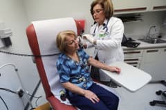 A doctor examines a patient in Miami, Florida.