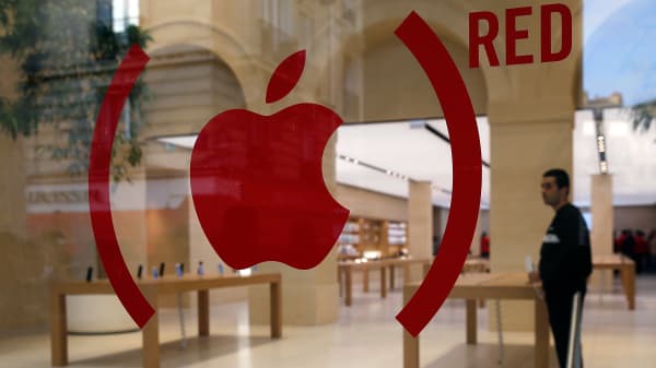 An Apple red logo is displayed for the fight against aids on the facade of the new Apple store. Apple is releasing Special Edition iPhone 7 and Apple Watch in Red.
