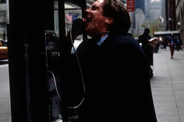 Christian Bale at pay phone in a scene from the film 'American Psycho', 2000.